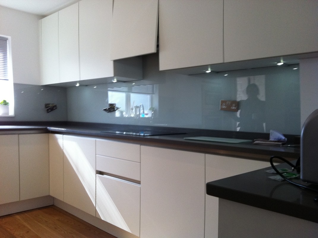 Grey glass kitchen splashback with LED lighting in Wallington