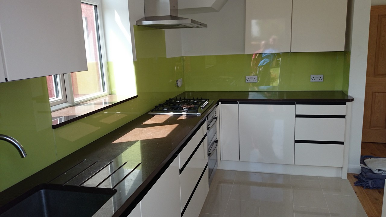 Lime green glass kitchen splashback installed by Wallington glaziers