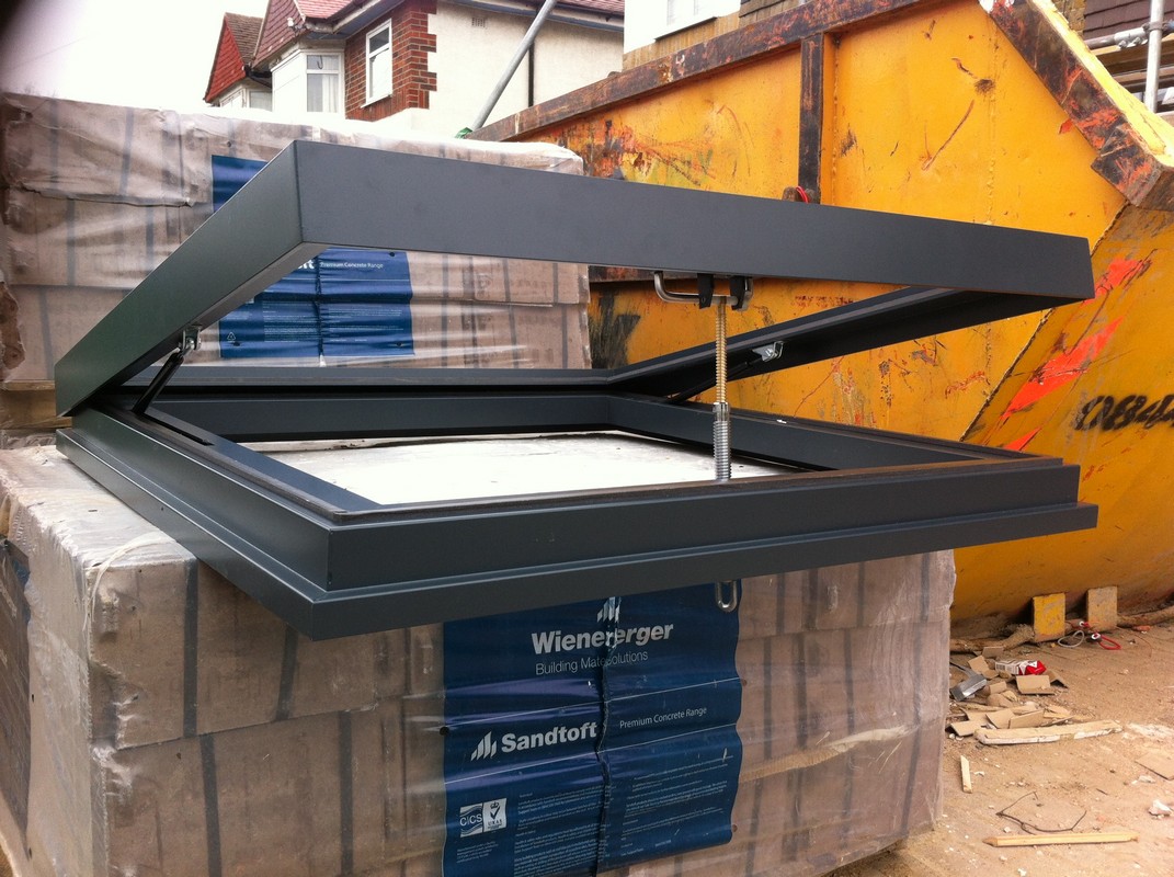 Opening flat roof skylight in anthracite grey installed in Wallington